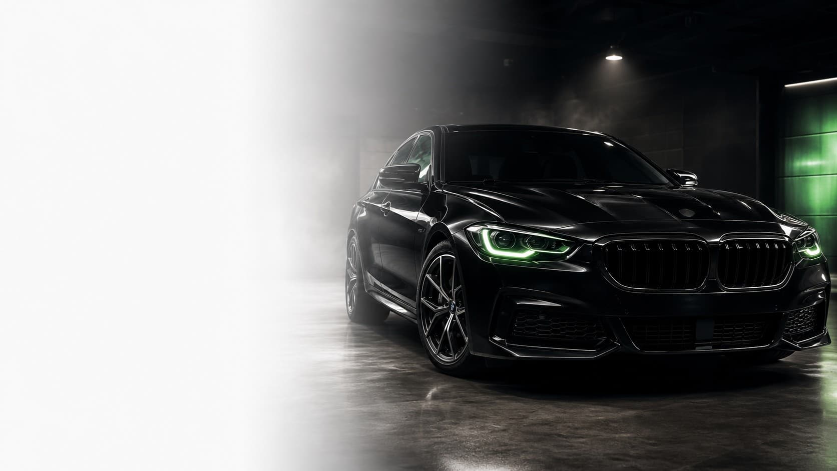 Black sedan in a premium garage